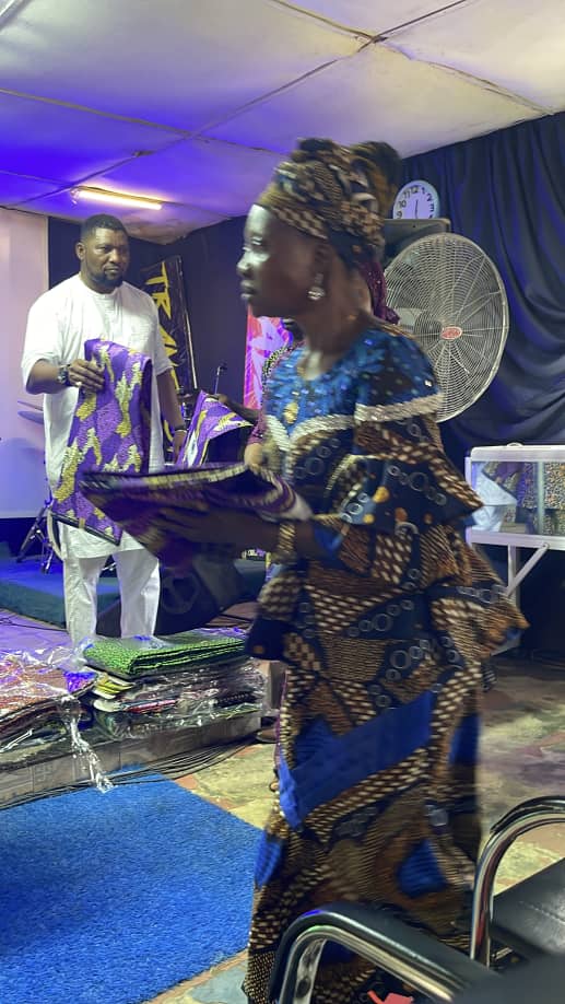 Women receiving essential fabrics and materials for their families
